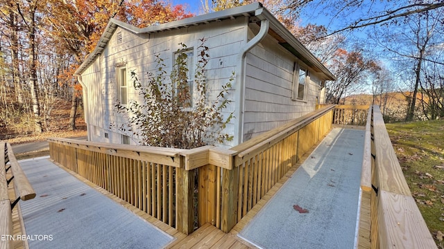 view of side of property with a deck