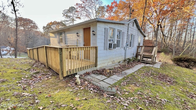 exterior space featuring cooling unit and a deck