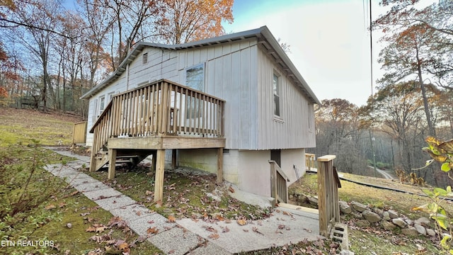 view of property exterior featuring a deck