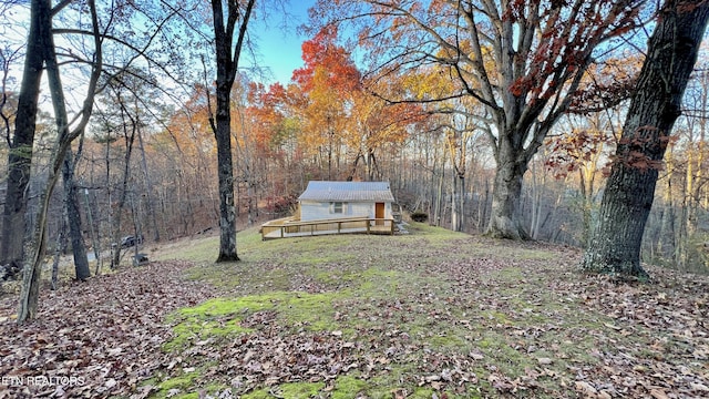 view of yard featuring a wooden deck