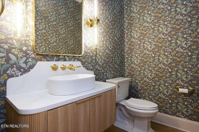 bathroom with vanity and toilet