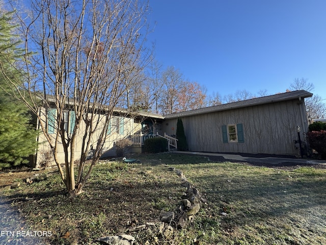 exterior space with a front lawn