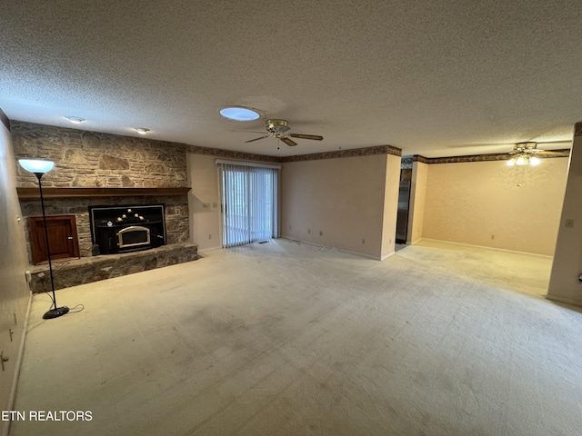 unfurnished living room featuring carpet floors and a textured ceiling