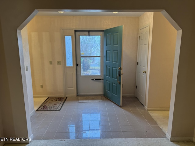 entryway featuring light tile patterned flooring