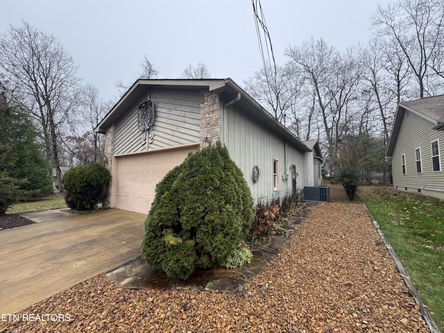 view of side of property with a garage