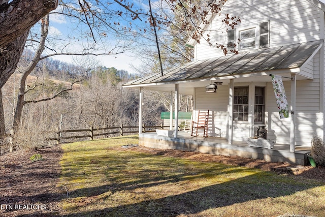 view of yard featuring covered porch