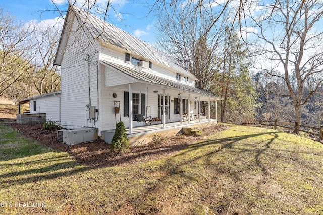 view of home's exterior featuring a lawn and a porch