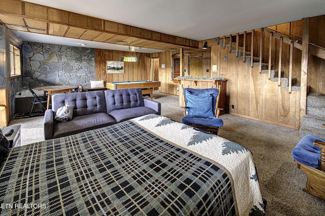 carpeted living room with wooden walls and billiards