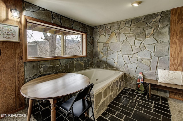 bathroom with a washtub