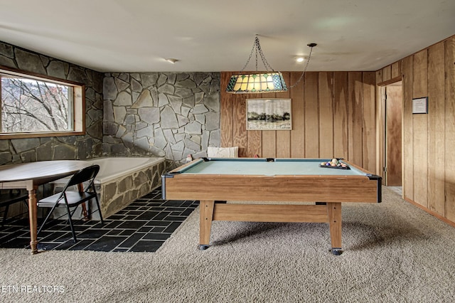 game room with wooden walls, dark carpet, and pool table