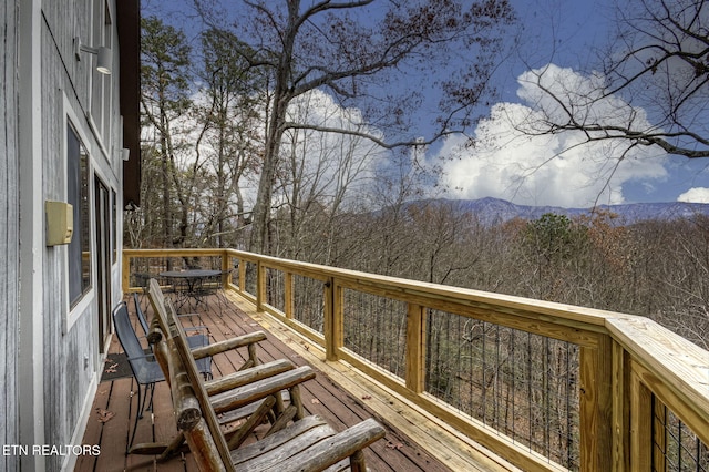 wooden terrace with a mountain view