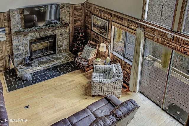 living room with a fireplace and hardwood / wood-style flooring