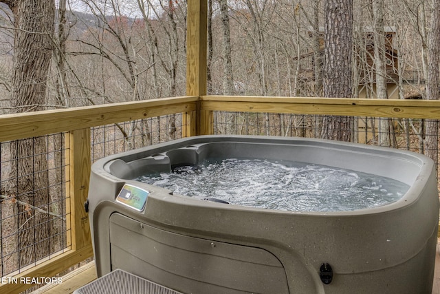 deck featuring a hot tub