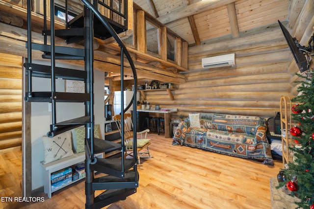 interior space featuring a wall mounted air conditioner, beam ceiling, wooden ceiling, and rustic walls