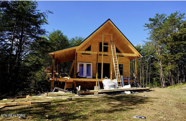 back of property featuring french doors