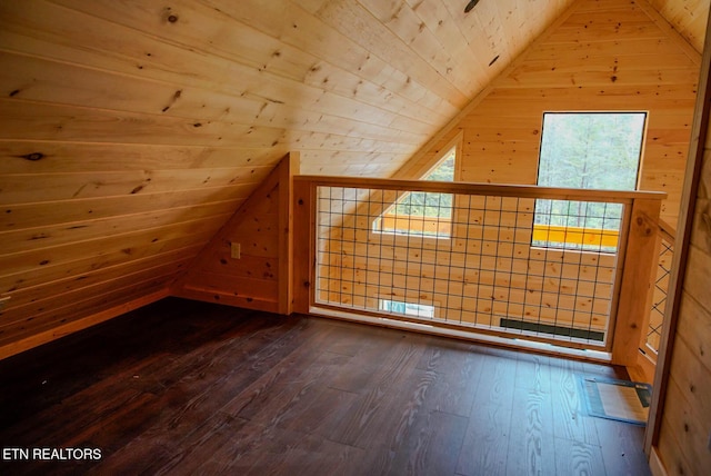 bonus room with wood ceiling, wooden walls, dark hardwood / wood-style floors, and vaulted ceiling