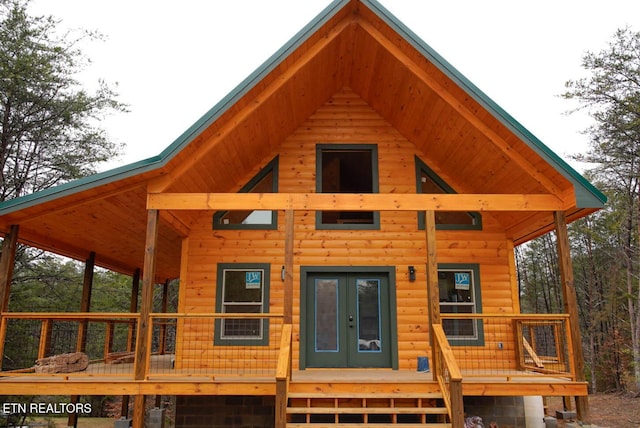 rear view of house featuring french doors