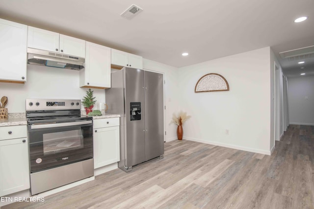 kitchen with light stone counters, light hardwood / wood-style flooring, white cabinets, and stainless steel appliances