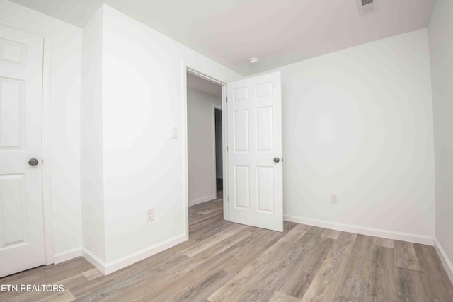 unfurnished room featuring light wood-type flooring