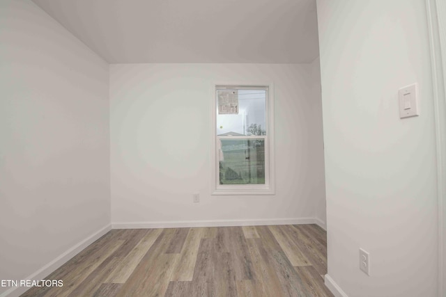 unfurnished room with light wood-type flooring