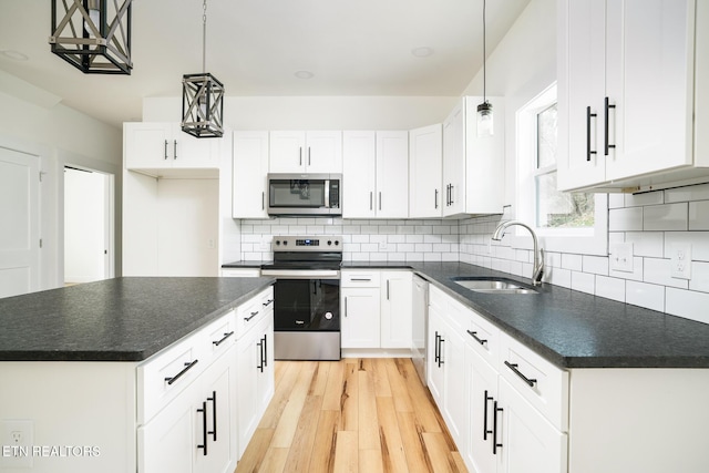 kitchen featuring white cabinets, sink, and stainless steel appliances