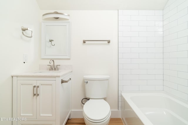 full bathroom featuring vanity, toilet, and tiled shower / bath combo