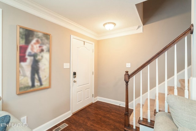 entryway featuring crown molding and dark hardwood / wood-style floors