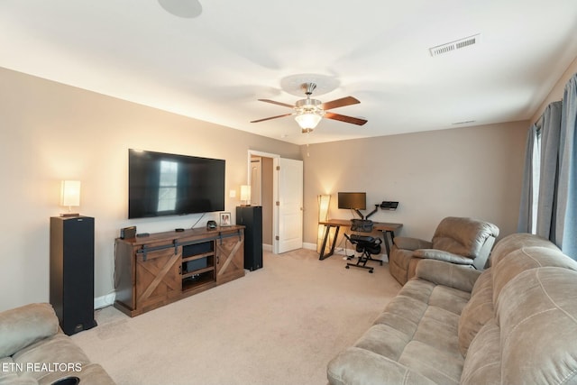 living room featuring light colored carpet and ceiling fan