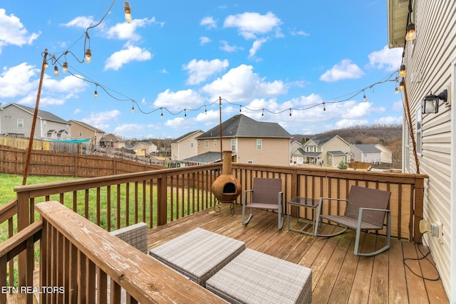 wooden deck featuring a yard