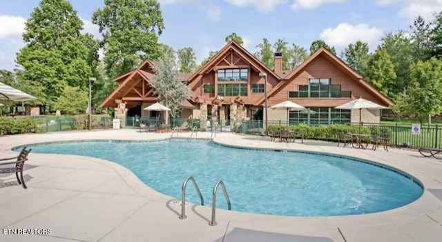 view of swimming pool featuring a patio