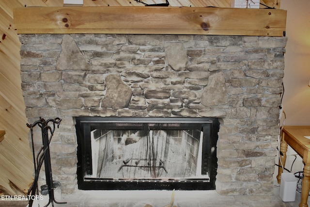 room details featuring a stone fireplace