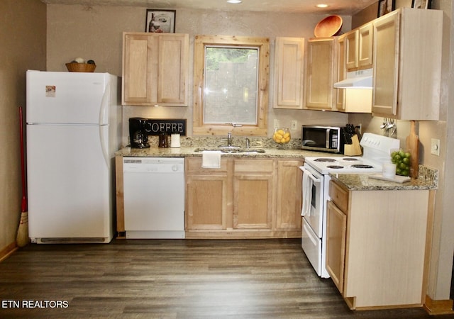 kitchen with under cabinet range hood, white appliances, light brown cabinets, and a sink