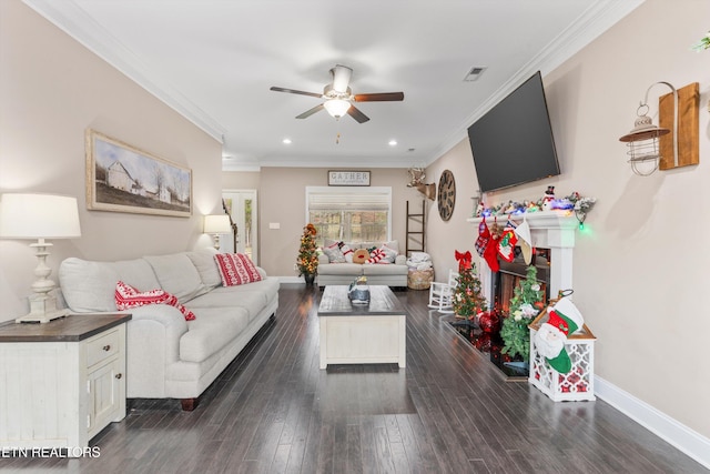 living room with dark wood-type flooring, visible vents, ornamental molding, and baseboards