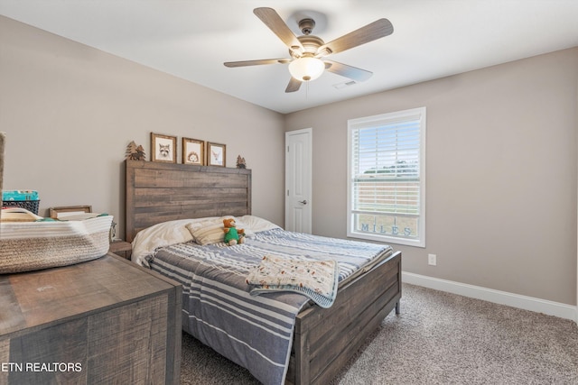 carpeted bedroom featuring visible vents, ceiling fan, and baseboards