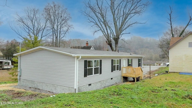 back of house featuring a yard