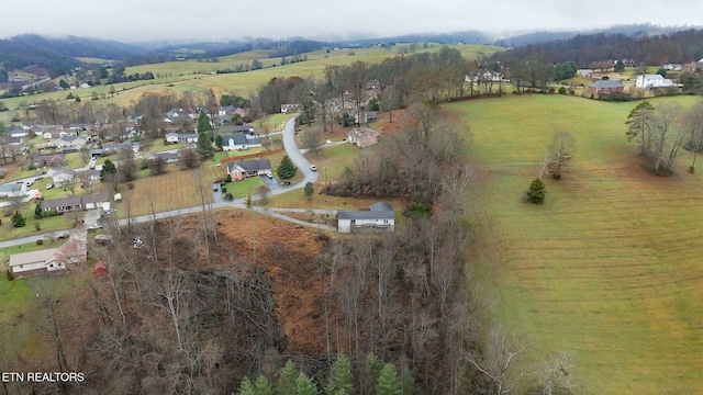 birds eye view of property with a rural view