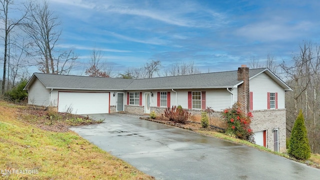 ranch-style house featuring a garage