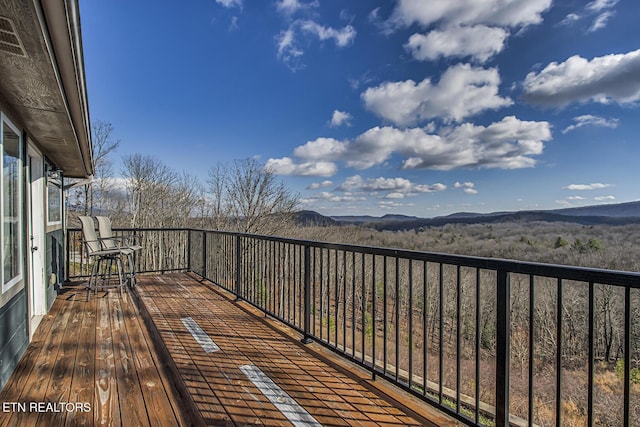 wooden terrace with a mountain view