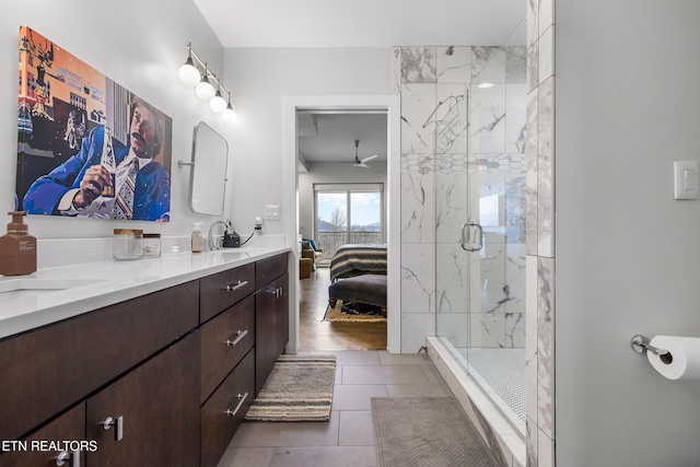 bathroom with wood-type flooring, vanity, and an enclosed shower