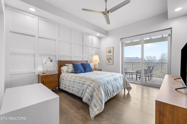 bedroom with ceiling fan, dark hardwood / wood-style flooring, and access to outside