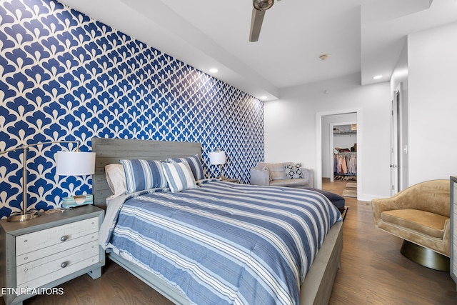 bedroom with ceiling fan and dark hardwood / wood-style flooring