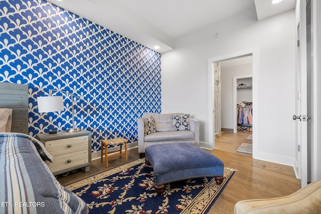 sitting room with light hardwood / wood-style flooring