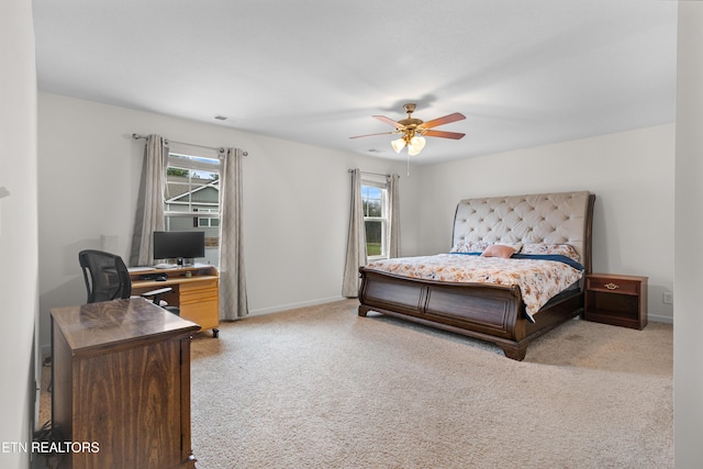 bedroom featuring ceiling fan and light colored carpet