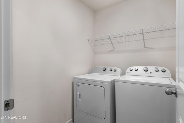 washroom with washing machine and dryer