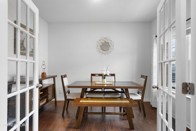 dining room featuring dark hardwood / wood-style flooring and french doors