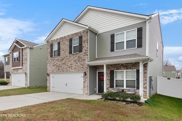 view of front of home featuring a front lawn and a garage