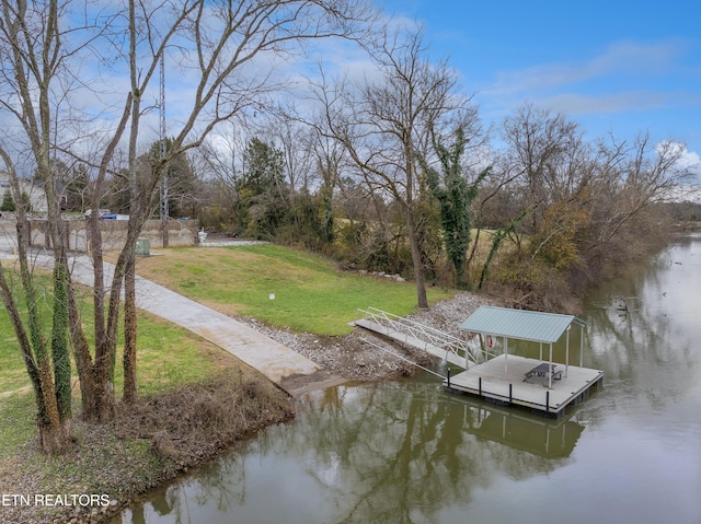 dock area featuring a water view and a yard