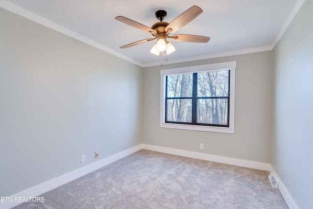 empty room with carpet flooring, ceiling fan, and ornamental molding