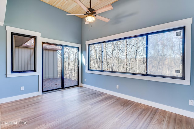 interior space featuring access to exterior, ceiling fan, wooden ceiling, light hardwood / wood-style floors, and vaulted ceiling