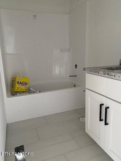 bathroom with vanity and tile patterned flooring